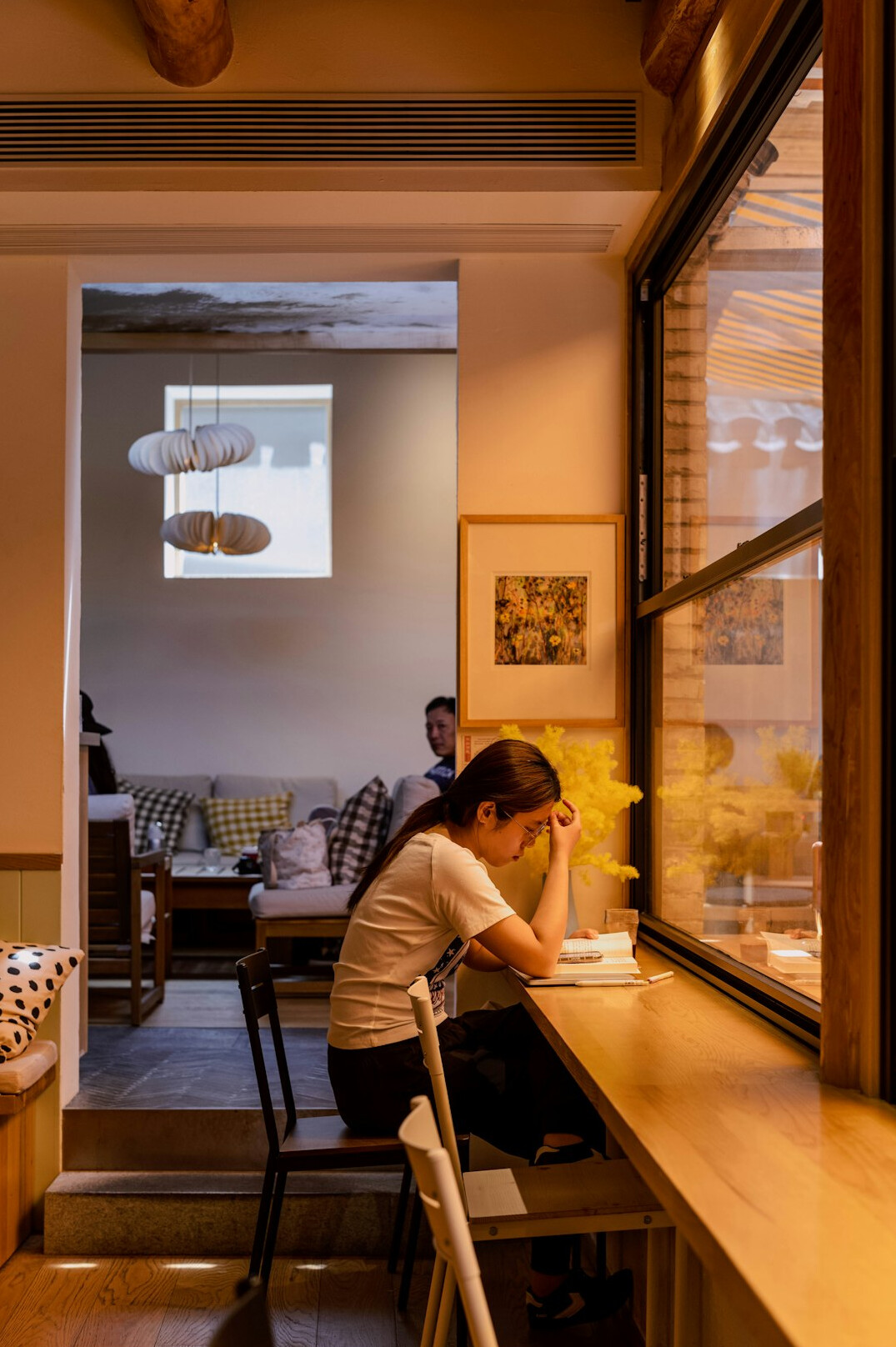 person reflecting at desk