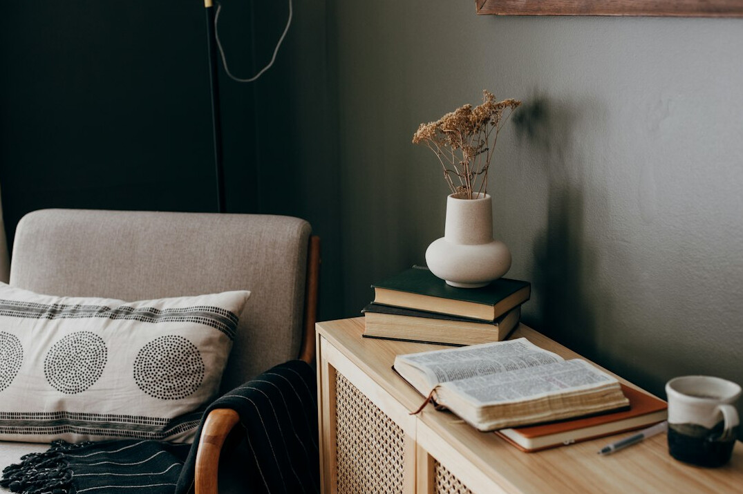 woman reading book in cozy room