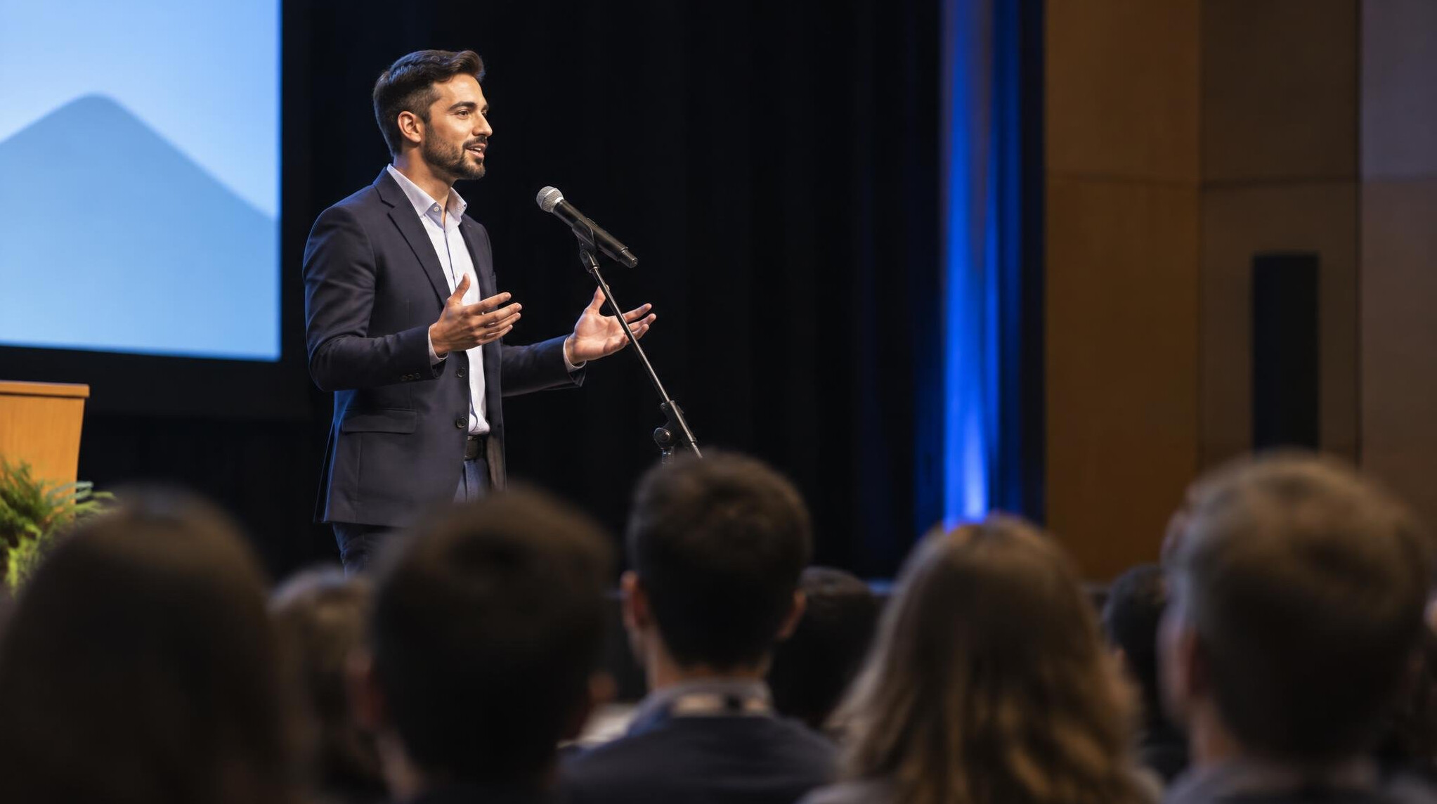 person giving speech on stage